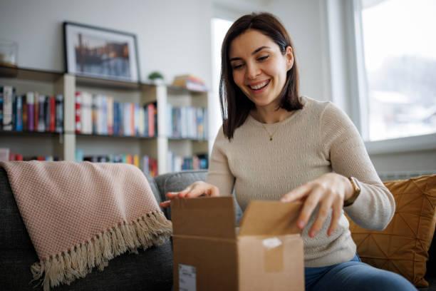 Woman opening her medication package at home