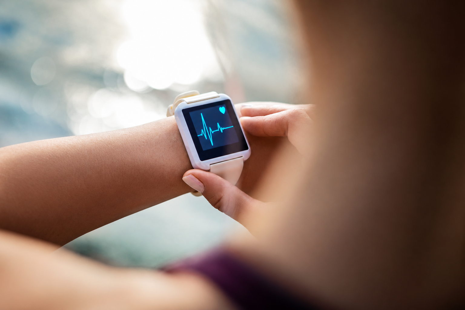 A person checking heart health on a smartwatch